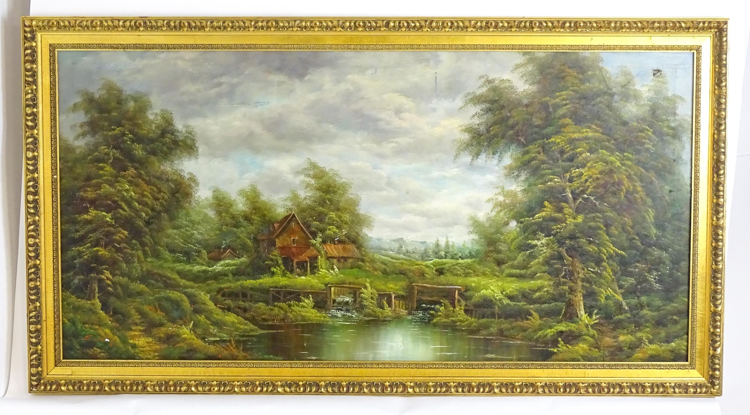 Late 19th / 20th century, English School, Oil on canvas, A wooded river landscape with watermill.