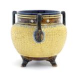 A Royal Doulton stoneware gilt circle tyg of cauldron form with three mottled blue handles, banded