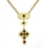 A silver gilt pendant necklace of cross form with garnet coloured paste stones approx 16 1/2" long