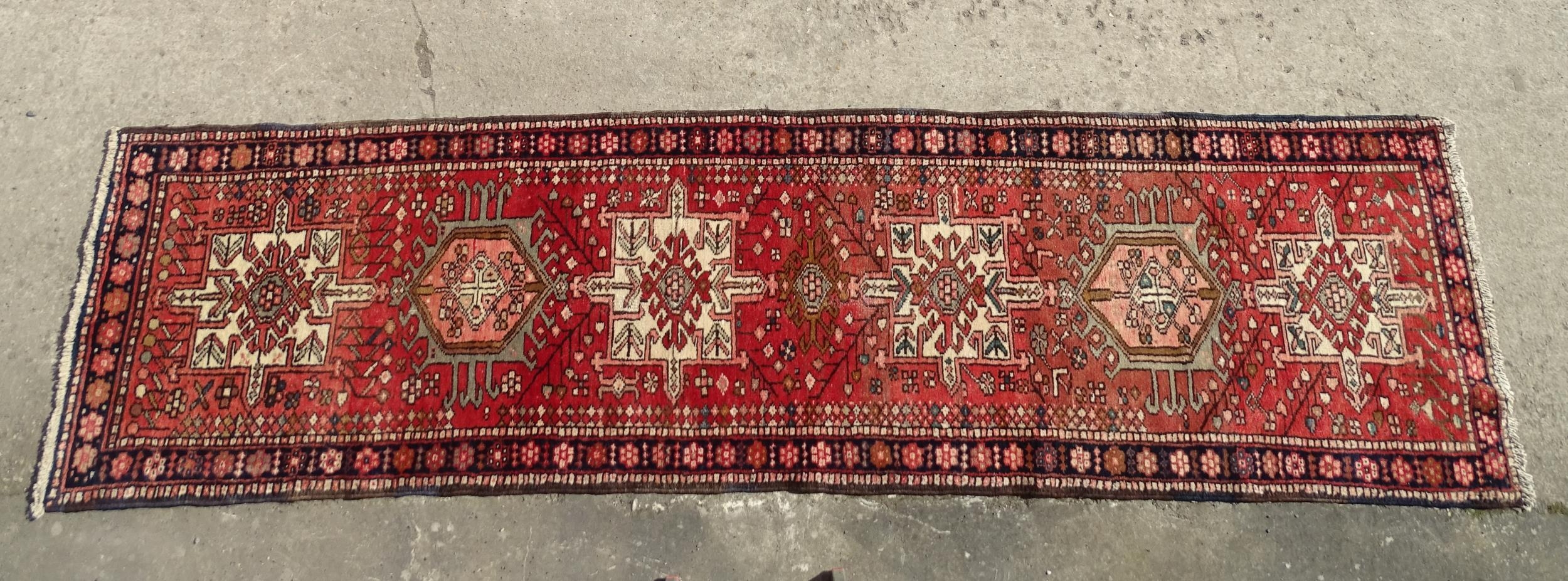 Carpet / Rug : A North West Persian Heriz runner with red ground having central medallions with - Image 2 of 8