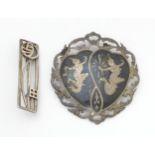 A silver brooch inspired by the designs of Charles Rennie Macintosh, together with a brooch marked