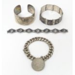 Assorted silver bracelets to include two Siam silver examples, a silver bracelet set with coin