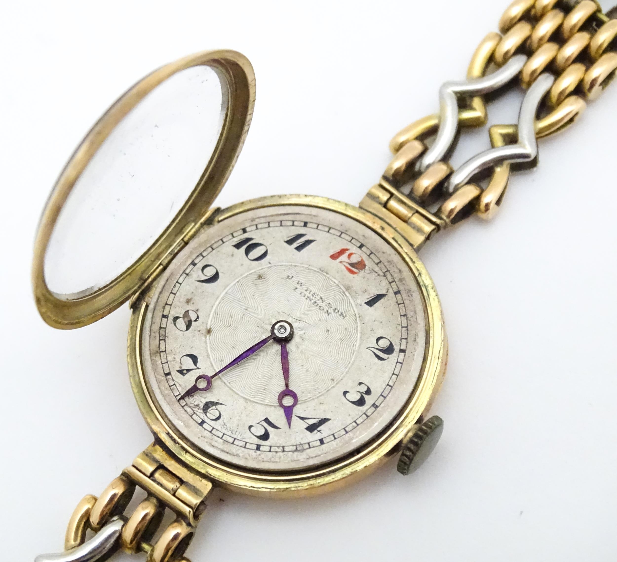 A c.1925 9ct gold cast ladies wristwatch, the dial with engraved decoration, Arabic numerals and - Image 6 of 11