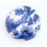 A Chinese blue and white ink pot and cover of circular form, decorated with figures in a