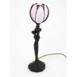 An Art Nouveau style figural table lamp with tulip formed pink glass shade. Approx 19" high Please