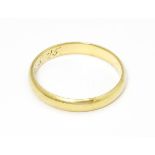 A 14ct gold wedding band marked 585 RDJ and maker Scheel . Ring size approx. Q 1/2 Please Note -