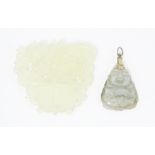 An oriental carved bowenite jade pendant approx 2" long, together with another (2) Please Note -