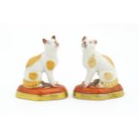 A pair of porcelain models of cats in the manner of Chelsea. Marked under with gilt anchor.