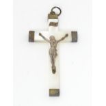 A mother of pearl crucifix pendant. Approx 2 1/" long Please Note - we do not make reference to