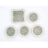 Five items of Royal Doulton decorated in the Persian pattern D3550 comprising four plates and a
