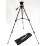 A cased telescoping and extending Vanguard camera / photography tripod, approx 52" high (expanded)