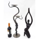 A blacksmith-made wrought iron candelabra, together with a carved figure, the largest approx 26"