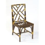 A Vintage side chair of simulated bamboo and rattan construction, in the manner of a Chinese