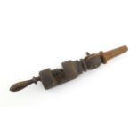 A 19thC turned wooden wig clamp. Approx. 13 1/2" Please Note - we do not make reference to the