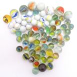 A quantity of assorted glass marbles, many with colours twists. Largest approx. 1" diameter (Approx.
