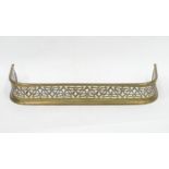 A brass fire fender with pierced detail. Approx. 29 1/2" wide Please Note - we do not make reference