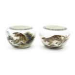 A pair of Oriental ceramic salts with tiger decoration and Character script. Character marks