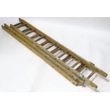 A wooden extending ladder. Extending to approx 18ft Please Note - we do not make reference to the