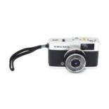 An Olympus Trip 35 compact 35mm film camera with wrist strap. Please Note - we do not make reference