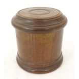 An early 20thC turned mahogany treen box and cover / container of cylindrical form with banded