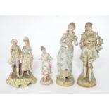 Four Continental figures comprising a figural group depicting a young couple, a pair of figures with