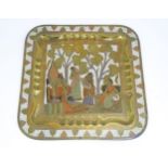 A Persian brass tray of squared form with engraved decoration depicting a garden landscape with a