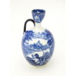 A blue and white Cauldon vase with single handle decorated in the Chariot pattern. Marked under.