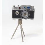 A 20thC 'KKW Camera Lighter' novelty table top cigarette lighter modelled as a vintage camera on