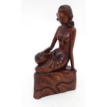A carved wooden model of a seated nude. Approx. 11 3/4" high Please Note - we do not make