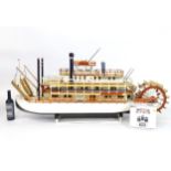 A 20thC scratch built scale model of a 19thC paddle steamer boat , ' Mississippi Swan' , of wooden