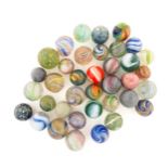 Toys: A quantity of assorted vintage marbles, many with colours twists, etc. Contained within a