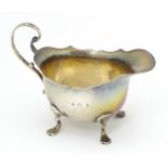A silver cream jug hallmarked Birmingham 1901 maker E S Barnsley & Co (Edward Souter Barnsley) 4"