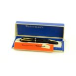 A c1950 boxed Waterman's Champion 501 black fountain pen with 14ct gold W-2B nib, matching