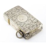 An early 20thC silver lighter with engraved acanthus scroll decoration hallmarked Birmingham 1909