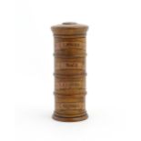 A four tier treen spice tower labelled Ginger, Mace, Cloves, and Nutmeg. Approx. 7 1/2" high