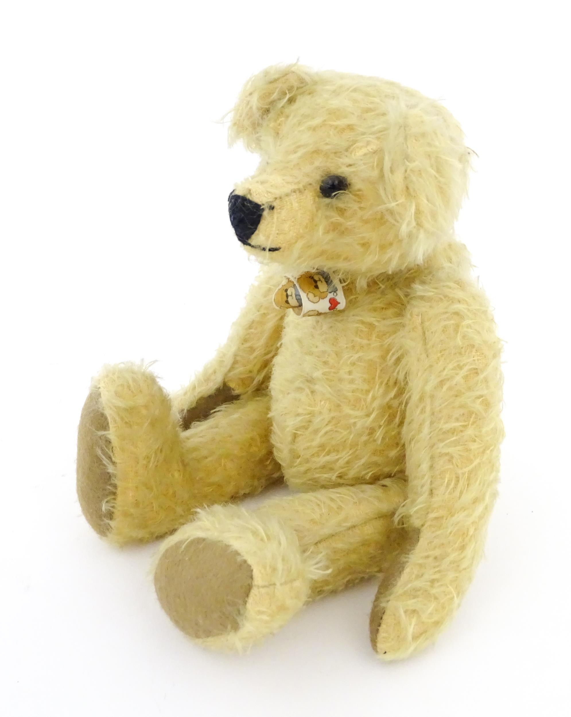 Toy: A 20thC mohair teddy bear with stitched nose and mouth, pad paws, and articulated head and - Image 3 of 7