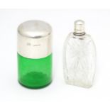 A green glass salts bottle with silver lid hallmarked Birmingham 1904 maker Hillard & Thomason.
