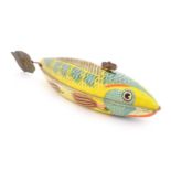 Toy: A 20thC lithographed tinplate clockwork model fish. Marked Made in Great Britain under. Approx.