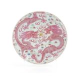 A Chinese famille rose dragon dish with two dragons, flaming pearl and stylised clouds. The