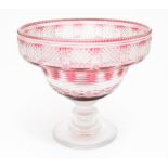 A 19thC cut glass / crystal pedestal bowl with cranberry flash detail. Approx 9 1/2" high x 10 1/