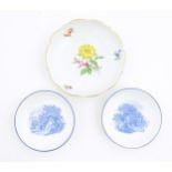 A Continental dessert plate with hand painted flower detail, marked under with Meissen style crossed