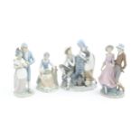 Three Nao figure groups to include Grape Tasters, Girl and Boy with Dove, and Girl and Boy wearing