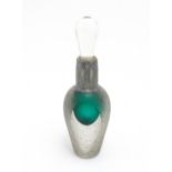 A scent / perfume bottle with green detail and silver overall decoration to neck by Sileda Ltd.