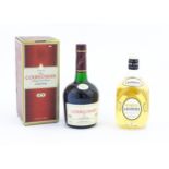 A 70cl bottle of Lauder's Scotch whisky, together with a boxed 700ml bottle of Courvoisier Luxe