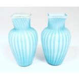 Two turquoise trailed glass vases. Approx 9 1/4" high (2) Please Note - we do not make reference