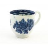 A John Pennington Liverpool blue and white coffee cup decorated in the Peony and Daisy pattern