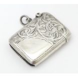 A silver vesta case with engraved decoration, hallmarked Birmingham 1918, maker Joseph Gloster