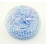 An art glass paperweight with swirled and bullicante detail. Approx. 3 1/4" diameter Please Note -