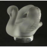 A Lalique model of a swan. Approx 2" high Please Note - we do not make reference to the condition of
