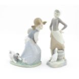 Two Lladro figures comprising Girl with Milk Pail, no. 4682, and Naughty Dog, 4982. Marked under.